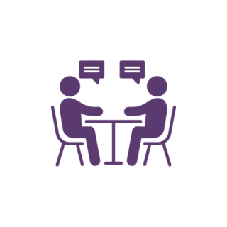 Two people talking at a table icon.